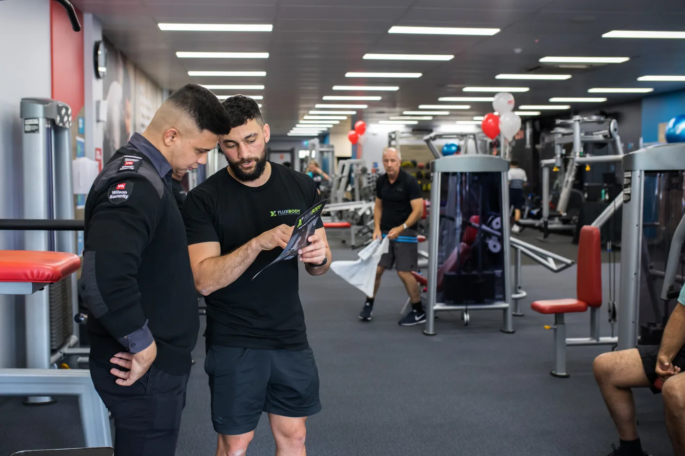 Ayden explaining body composition results on a result screen
